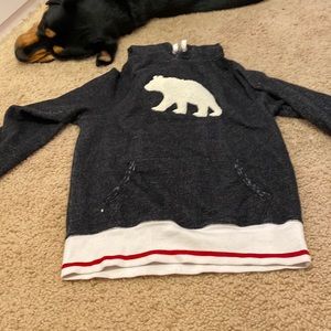Black sweater with white Bear and red and white sleeve and end